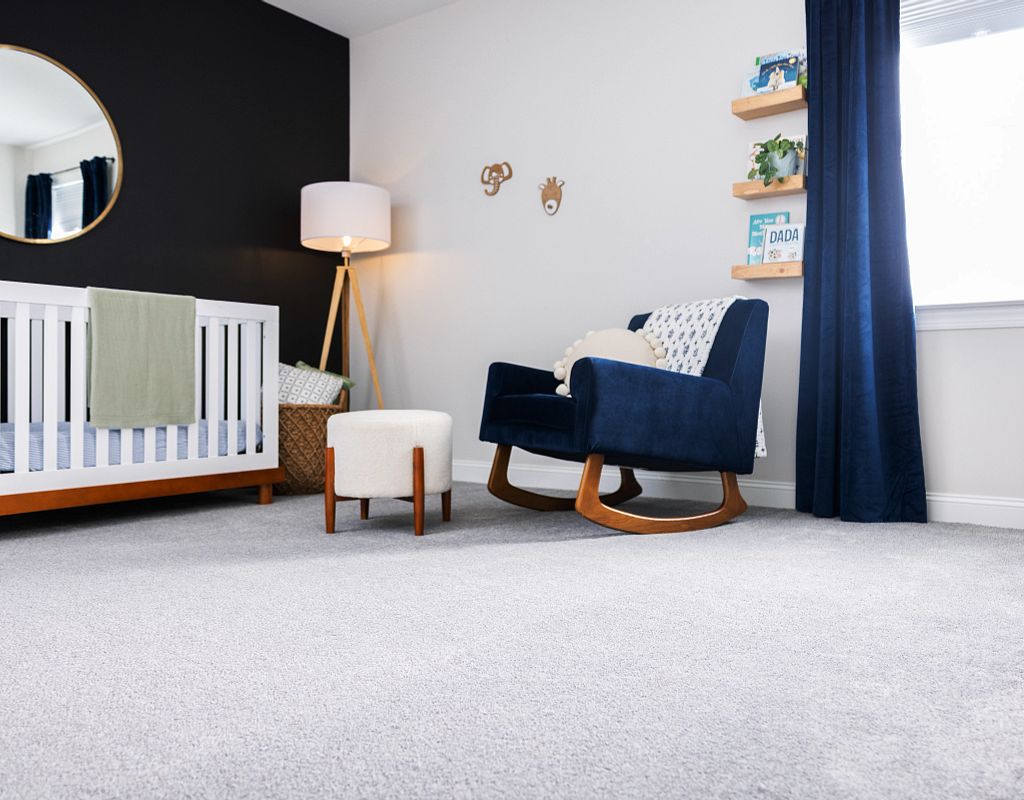 Blue chair on carpet | Design Waterville