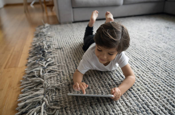 Girl lying on rug | Design Waterville